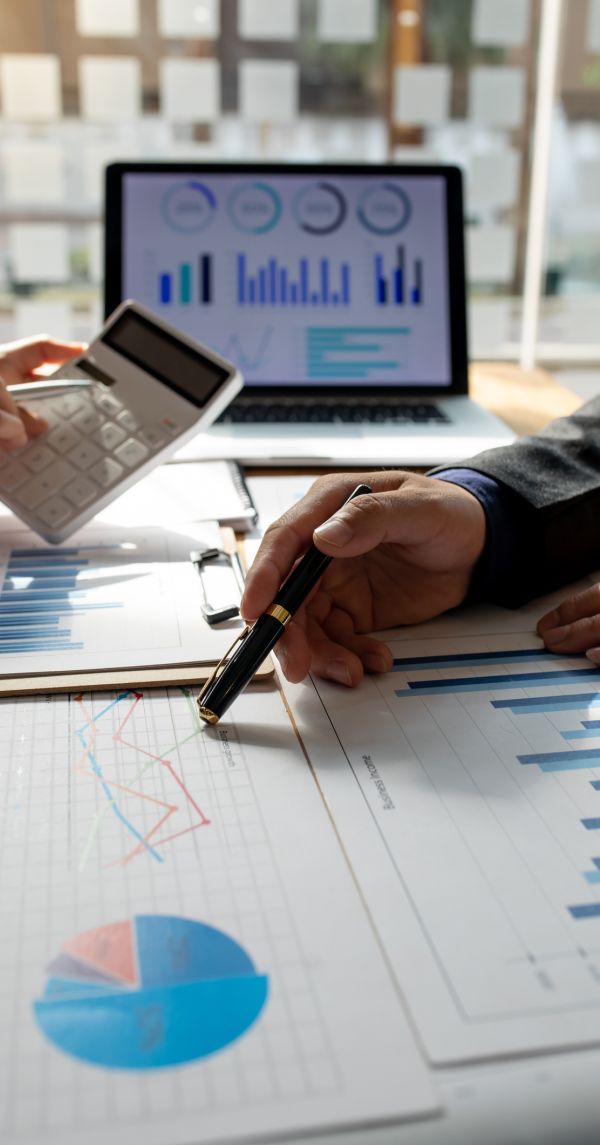 Businesswoman hands hold documents with financial statistic stock photo,discussion and analysis data the charts and graphs. Finance concept